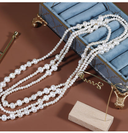 Threaded natural freshwater pearl sweater chain